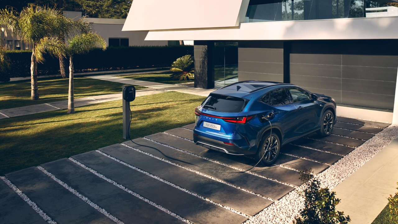 Lexus NX plugged into a charging station