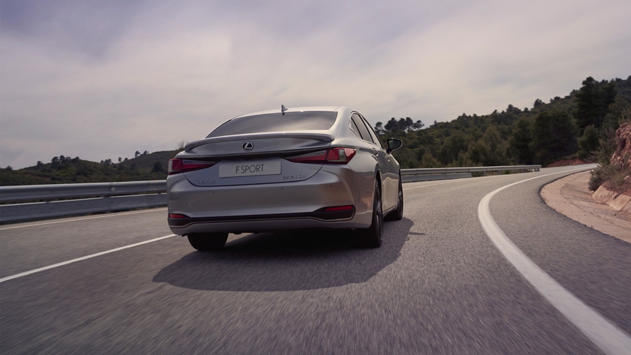 A Lexus ES 300h driving on a road