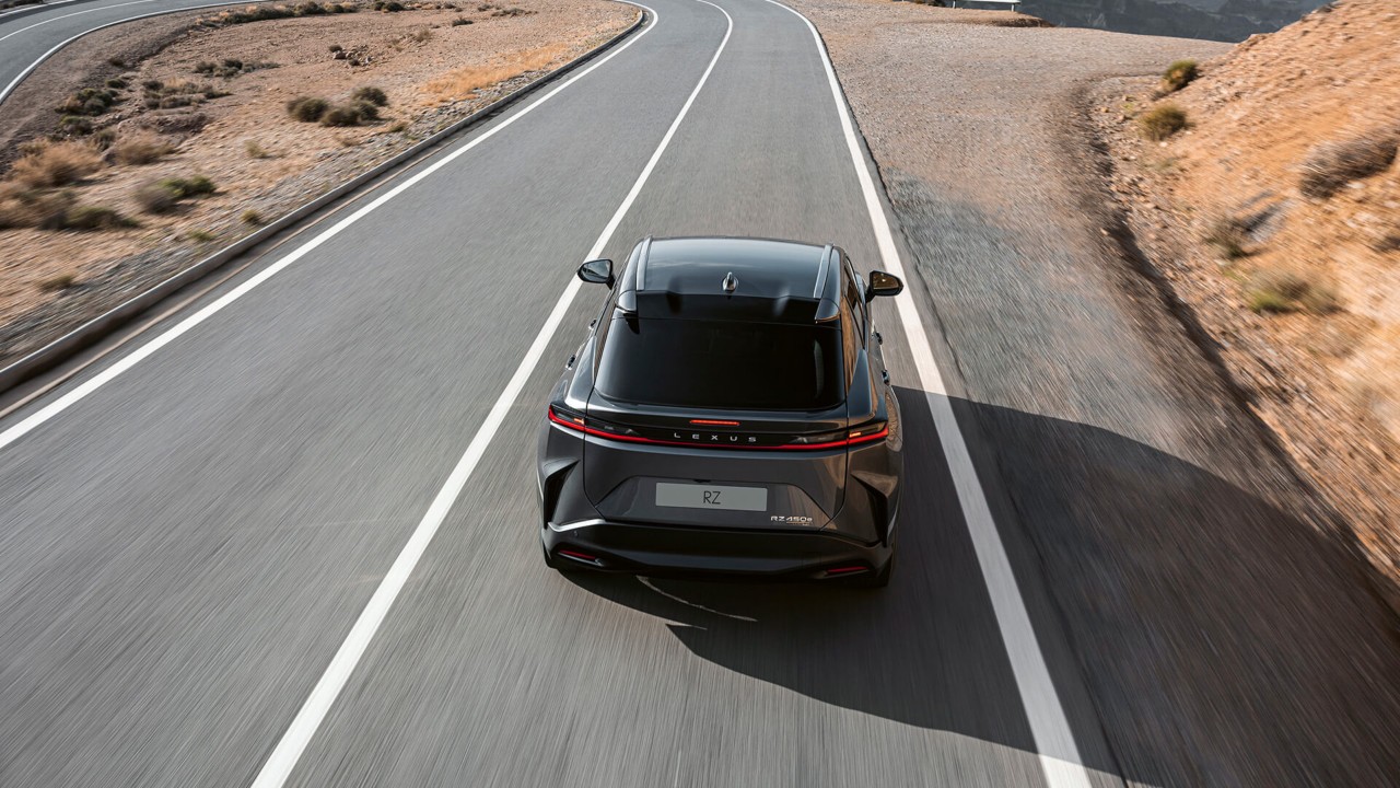 Rear view of the Lexus RZ 450e driving
