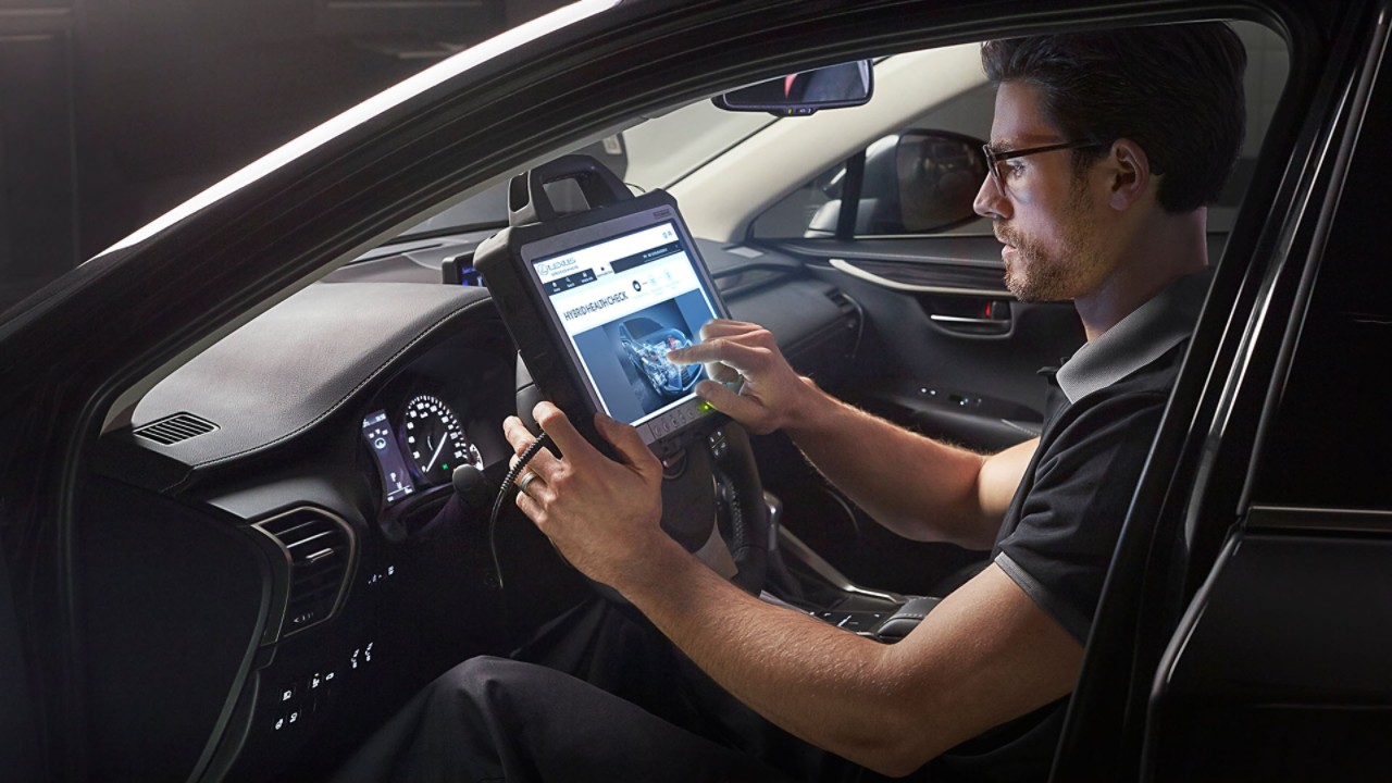 A Lexus mechanic running diagnostics